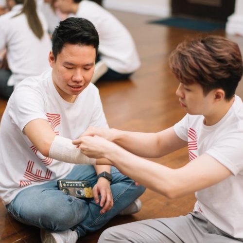 A Zeon Team Member Applies a Bandage for the First Responder TOT Course